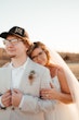 Bride In Tulle A-Line Wedding Dress Called Lorraine Lane Marie By Rebecca Ingram With Groom In Tan