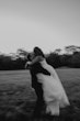 Bride Wearing Sparkly Ballgown Wedding Dress Called Zartasha By Sottero and Midgley Kissing The Groom