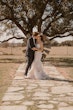 Bride wearing Bridget by Maggie Sottero kissing her husband