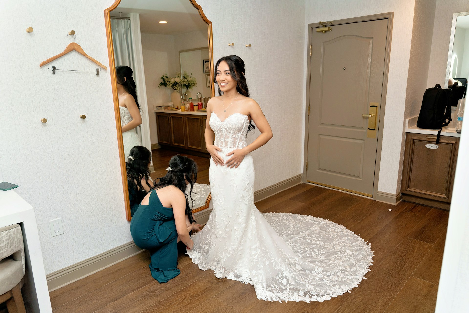 Bride Wearing Lace Fit And Flare Wedding Dress Called Fairchild By Maggie Sottero Getting Ready With A Bridesmaid