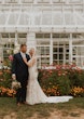 Bride wearing Greenley wedding dress by Maggie Sottero with her husband 