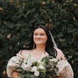 Bride Wearing Floral Jacquard Princess Wedding Gown Called Cyprus By Sottero And Midgley Holding White Floral And Leafy Bouquet