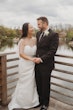 Bride wearing Clover by Rebecca Ingram with her husband