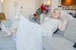 Bride wearing Riviera by Sottero and Midgley on the couch