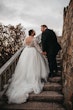 Bride In Lace Wedding Dress Called Mallory Dawn By Maggie Sottero With Illusion Lace Back With Groom