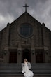 Bride wearing Barcelona by Sottero and Midgley outside of a church