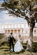 Groom With Bride Wearing Mikado A-Line Wedding Dress Raven By Maggie Sottero