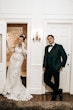 Bride wearing Kern by Maggie Sottero on the phone next to her husband