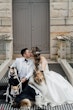 Bride Wearing Princess Ballgown Wedding Dress Called Kimora By Sottero And Midgley Kissing Groom With 3 Dogs