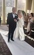 Bride wearing Ekaterina by Maggie Sottero being walked down the aisle