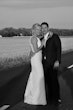 Real Bride in Bead Embroidery Deep Keyhole Back Wedding Dress Named Bellarose By Rebecca Ingram with Groom