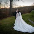 Bride wearing Seneca wedding dress by Sottero and Midgley with her husband