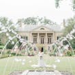 Bride In Elegant Floral Wedding Dress Called Cruz By Sottero And Midgley With Fountains And Mansion