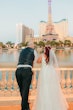 Groom and Bride at a Las Vegas Wedding Wearing Lace Ballgown Called Ellen by Rebecca Ingram