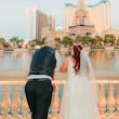 Groom and Bride at a Las Vegas Wedding Wearing Lace Ballgown Called Ellen by Rebecca Ingram