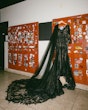 Black Lace Wedding Dress Called Zander Lane By Sottero And Midgley Hanging From Some Lockers