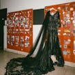 Black Lace Wedding Dress Called Zander Lane By Sottero And Midgley Hanging From Some Lockers