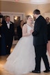 Real Bride In Ruffled Wedding Dress Called Fatima By Maggie Sottero With Groom During Reception