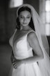 Real Bride in Mikado A-Line Bridal Dress with Plunging V-Neckline Called Raven Marie by Maggie Sottero