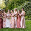 Bride wearing Hattie Marie by Rebecca Ingram laughing with her bridesmaids