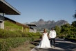 Bride wearing Tatiana wedding dress by Maggie Sottero with her husband