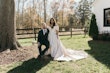 Groom Sitting Next To Bride Wearing Floral Ballgown Wedding Dress Called Derrick Marie