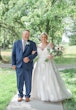 bride in v-neckline wedding dress called meryl by maggie sottero with groom