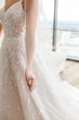 Bride wearing Marvine wedding gown by Sottero and Midgley 