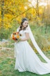 Bride Wearing Satin Aline Wedding Dress Called Ekaterina By Maggie Sottero In A Forest