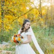 Bride Wearing Satin Aline Wedding Dress Called Ekaterina By Maggie Sottero In A Forest