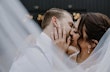 Groom Kissing Bride In White Wedding Dress Named Sadie By Rebecca Ingram 