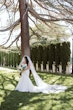 Bride wearing Hattie Lynette wedding dress by Rebecca Ingram