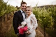 Groom with Bride in Vintage Inspired Puff Sleeve Mermaid Wedding Dress in 3-D Floral Motifs Called Cruz by Sottero & Midgley