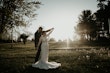 Real Bride in Illusion V-Back Sheath Wedding Gown with Lace Motifs and Side Illusion Panels Called Angie by Rebecca Ingram