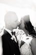 Bride wearing Hamilton wedding dress by Sottero and Midgley kissing her husband