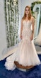Bride Wearing Fit-and-Flare Wedding Dress Called Wendi By Rebecca Ingram In A Dressing Room