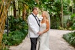 Bride Wearing Lace Mermaid Wedding Dress Called Bronson By Sottero And Midgley Looking At Groom In A Garden