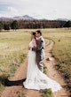 Groom Holding Bride Wearing Sexy Lace Wedding Dress Called Hazel By Rebecca Ingram