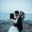 Groom With Bride Wearing Long Sleeve Ball Gown Wedding Dress With A Tiered Organza Skirt Tessa By Rebecca Ingram