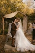 Bride With Bride Wearing Asymmetrical Wedding Gown Winona By Rebecca Ingram