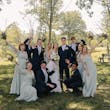 Bride wearing Charlotte by Rebecca Ingram with her wedding party