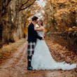 Bride wearing Lettie wedding dress by Rebecca Ingram kissing her husband