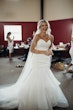Bride laughing wearing mermaid wedding dress called Jacqueline.