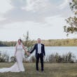 Bride with groom wearing budget friendly fit and flare wedding dress