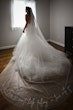 Bride wearing Holden wedding dress by Sottero and Midgley with veil