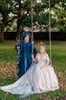 Bride Wearing Jaquard Wedding Dress Called Derrick Marie By Maggie Sottero With Her Partner In A Blue Gown