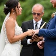 Bride with groom wearing crepe sheath wedding dress