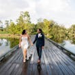 Bride Wearing Grecian Inspired Wedding Dress Called Gabrielle By Maggie Sottero On A Boardwalk With Groom