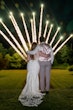 Bride wearing Nikki by Maggie Sottero and her husband watching fireworks