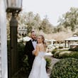 Groom Smiling At Bride In A White Strapless Wedding Dress Named Mitchell By Maggie Sottero